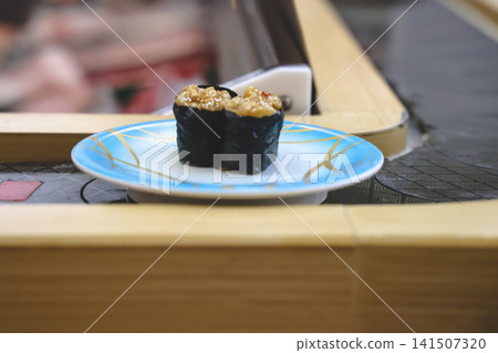 April 30 2026 Grilled minced seafood gunkan sushi on plate 141507320