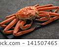 A luxurious boiled snow crab served on a black plate. 141507465