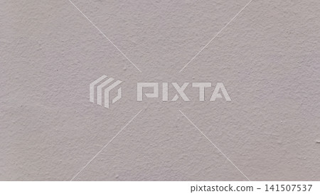 Close up high angle view of a uniformly lit gray concrete wall with fine bumps, roughness, and subtle surface variation a clean, neutral background texture. Close up high angle view of a uniformly lit gray concrete wall with fine bumps, roughness, and subtle surface variation a clean, neutral background texture. 141507537