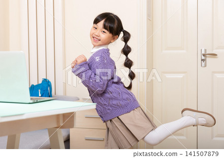 Asian Elementary School Girl Doing Stretching Exercise at Home, Online Learning and Healthy Lifestyle Concept Asian Elementary School Girl Doing Stretching Exercise at Home, Online Learning and Healthy Lifestyle Concept 141507879