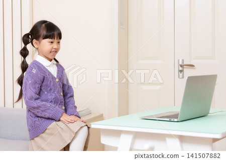 Asian Elementary School Girl Doing Stretching Exercise at Home, Online Learning and Healthy Lifestyle Concept Asian Elementary School Girl Doing Stretching Exercise at Home, Online Learning and Healthy Lifestyle Concept 141507882