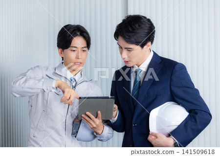 A businessman wearing work clothes A businessman wearing work clothes 141509618