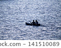 2 people on a small boat 141510089