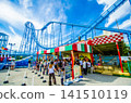Amusement park: People lining up to ride a thrilling roller coaster (blurred image) 141510119