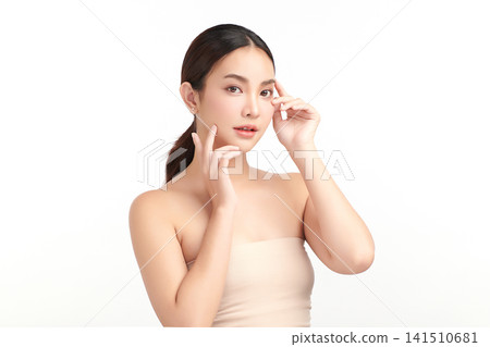 A beautiful young Asian woman with clean, fresh skin against a white background. Skincare, facial treatment, cosmetology, beauty, and spa. An elegant portrait of an Asian woman. A beautiful young Asian woman with clean, fresh skin against a white background. Skincare, facial treatment, cosmetology, beauty, and spa. An elegant portrait of an Asian woman. 141510681