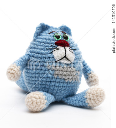 Knitted cat on a white background Knitted cat on a white background 141510706