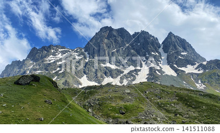 Chaukhi peaks dominate Georgia's Caucasus highlands, combining sheer rock walls, snow gullies and alpine terrain Chaukhi peaks dominate Georgia's Caucasus highlands, combining sheer rock walls, snow gullies and alpine terrain 141511088