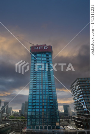 Rotterdam, The Netherlands. 08,07,2026. Modern High Rise Building at Sunset 141511222