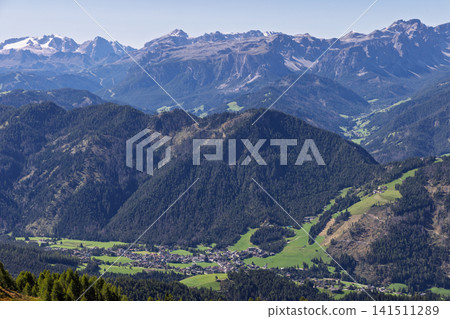 San Vigilio di Marebbe Far Below the Dolomite Peaks from Kronplatz in Italy San Vigilio di Marebbe Far Below the Dolomite Peaks from Kronplatz in Italy 141511289