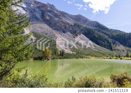 Le Piciodel lake on the Fanes plateau below the limestone wall of Col Bechei Le Piciodel lake on the Fanes plateau below the limestone wall of Col Bechei 141511319