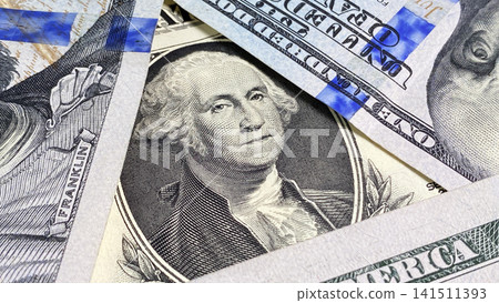 Portrait of George Washington in a triangle of $100 bills. Close-up. One dollar. The Masson symbol. The American national currency. One hundred dollar bills in cash. Portrait of George Washington in a triangle of $100 bills. Close-up. One dollar. The Masson symbol. The American national currency. One hundred dollar bills in cash. 141511393