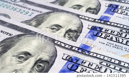 Benjamin Franklin's eyes. Close-up of one hundred dollar cash notes. The American national currency. US$ 100 bills. Economics, business and finance. Benjamin Franklin's eyes. Close-up of one hundred Benjamin Franklin's eyes. Close-up of one hundred dollar cash notes. The American national currency. US$ 100 bills. Economics, business and finance. Benjamin Franklin's eyes. Close-up of one hundred 141511395