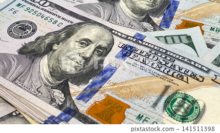 Paper money. Close-up. US$ 100 bills. Background of cash hundred dollar bills. Background of money. The American national currency. Paper money. Close-up. US$ 100 bills. Background of cash hundred dollar bills. Background of money. The American national currency. 141511398