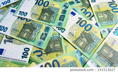 View of the scattered 100 euro bills. Cash banknotes. One hundred euros. Economics and finance. European currency. Background of cash Euro notes. View of the scattered 100 euro bills. Cash banknotes. One hundred euros. Economics and finance. European currency. Background of cash Euro notes. 141511627