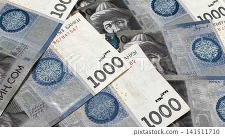 Background of Kyrgyz money. Banknotes in 1000 som. Economics and finance. The current money of Kyrgyzstan. A thousand som. Background of Kyrgyz money. Banknotes in 1000 som. Economics and finance. The current money of Kyrgyzstan. A thousand som. 141511710