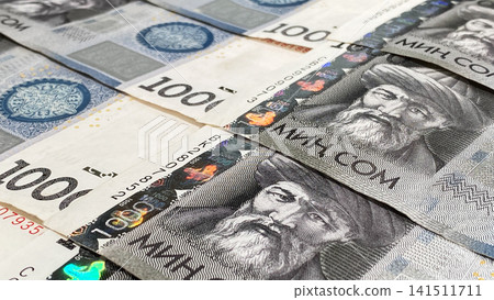 A thousand som. Close-up. Savings of the Kyrgyz. Kyrgyz national currency. Background of Kyrgyz money. Banknotes in 1000 som. Economics and finance. 141511711