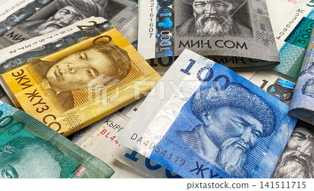 Cash banknotes of Kyrgyzstan. Business and finance. Folded in half bills in 5000, 1000 and 200 som, the current money of Kyrgyzstan. 141511715