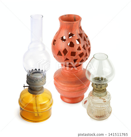 Vintage oil lamps and ceramic lantern isolated on white background. Collection of retro kerosene lamps and terracotta candle holder. Vintage oil lamps and ceramic lantern isolated on white background. Collection of retro kerosene lamps and terracotta candle holder. 141511765
