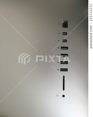 Close up of the ports and connectors on the back of a silver iMac computer. Close up of the ports and connectors on the back of a silver iMac computer. 141512212