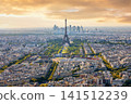 Scenic aerial panorama of Paris cityscape with Eiffel Tower during a vibrant golden hour sunset 141512239