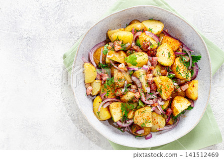 German potato salad, with bacon, onion and herbs, served in a bowl, homemade, no people, 141512469