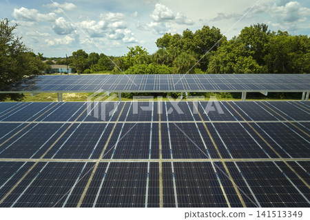 Solar panels installed over parking lot for parked cars for effective generation of clean energy Solar panels installed over parking lot for parked cars for effective generation of clean energy 141513349
