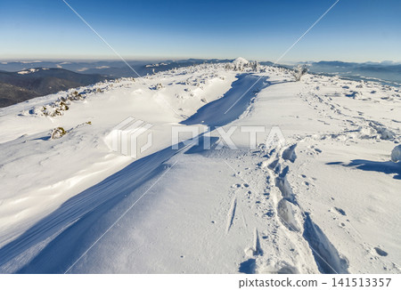 Snow covered mountains in sunny day. Colorful outdoor scene, Happy New Year celebration concept. Snow covered mountains in sunny day. Colorful outdoor scene, Happy New Year celebration concept. 141513357