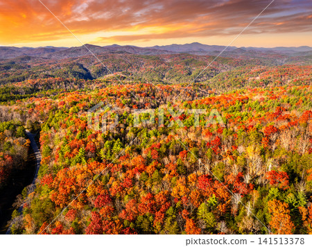 Scenic fall evening landscape of wooded Appalachian mountains. Colorful forest stretches across autumn mountain terrain. Scenic fall evening landscape of wooded Appalachian mountains. Colorful forest stretches across autumn mountain terrain. 141513378