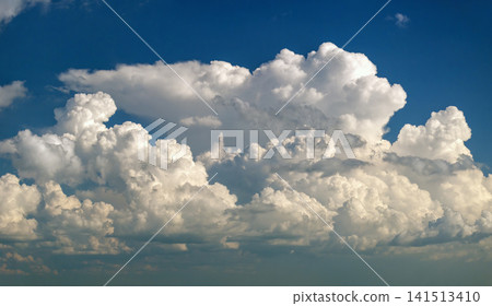 Rain clouds forming on blue Florida sky. Colorful summer skyscape Rain clouds forming on blue Florida sky. Colorful summer skyscape 141513410