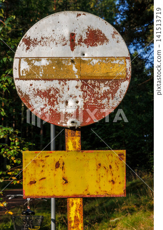 Weathered no entry sign on forest road near Hamina, Finland. Weathered no entry sign on forest road near Hamina, Finland. 141513719