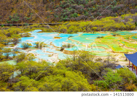 The Mystery of Nature: Five-Colored Ponds in Huanglong, Sichuan Province, China - Beautiful colored ponds on travertine terraces surrounded by lush greenery. The Mystery of Nature: Five-Colored Ponds in Huanglong, Sichuan Province, China - Beautiful colored ponds on travertine terraces surrounded by lush greenery. 141513800