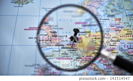 Bruxelles glass highlighting KIRUNA on paper map Bruxelles glass highlighting KIRUNA on paper map 141514547