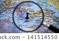 Map view with a magnifying glass showing a location in the Mediterranean 141514550