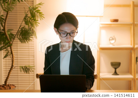 A woman who works late at night A woman who works late at night 141514611