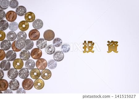Investment text and Japanese yen coins Investment text and Japanese yen coins 141515027