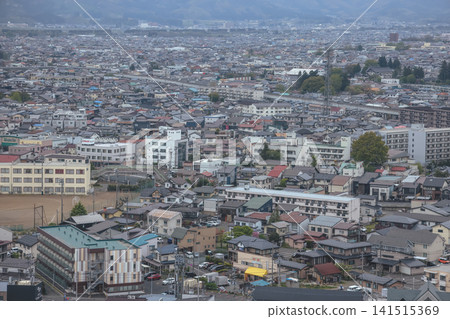 April 27 2026 MORIOKA, JAPAN. Wide view of city rooftops with elevated railway April 27 2026 MORIOKA, JAPAN. Wide view of city rooftops with elevated railway 141515369