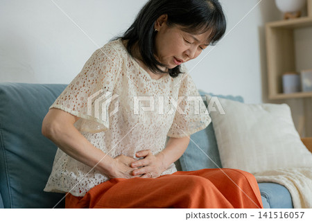 Senior woman with stomach ache Senior woman with stomach ache 141516057