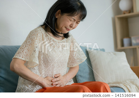 Senior woman with stomach ache Senior woman with stomach ache 141516094