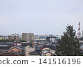 April 27 2026 Morioka urban residential rooftops with powerlines and distant skyline 141516196