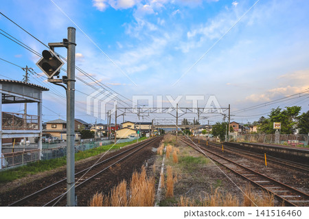 April 28 2026 Hitome Senbon Zakura railway corridor through suburban town with mountains April 28 2026 Hitome Senbon Zakura railway corridor through suburban town with mountains 141516460