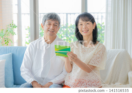 Senior woman with a bankbook Senior woman with a bankbook 141516535