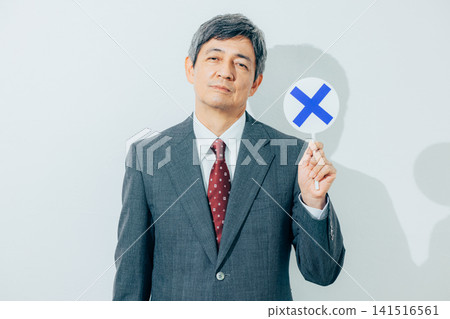 Businessman who puts out a cross Businessman who puts out a cross 141516561