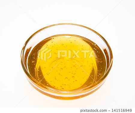 Honey in a glass bowl Honey in a glass bowl 141516949