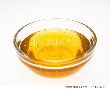 Honey in a glass bowl Honey in a glass bowl 141516950