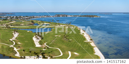 Waterfront golf course in Florida. Sports grounds with green grass in Boca Grande, small town on Gasparilla Island 141517162