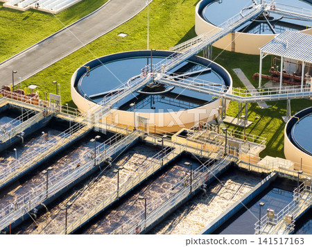 Water treatment facility at city wastewater cleaning plant. Purification process of removing undesirable chemicals, suspended solids and gases from contaminated liquid Water treatment facility at city wastewater cleaning plant. Purification process of removing undesirable chemicals, suspended solids and gases from contaminated liquid 141517163
