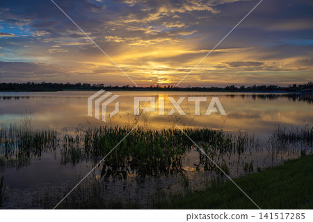 Sunset over lake water in southern tropical wetlands. Amazing Florida nature 141517285