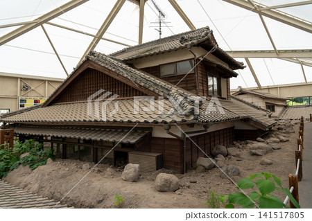 Nagasaki: A complete view of houses buried under rocks and mud from a debris flow is preserved and displayed. Nagasaki: A complete view of houses buried under rocks and mud from a debris flow is preserved and displayed. 141517805