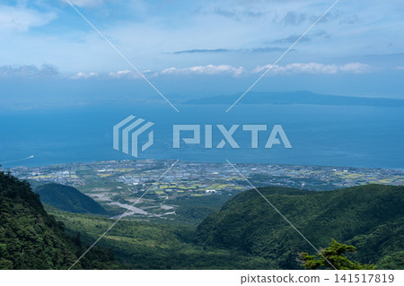 View from Nita Pass overlooking the debris flow traces of the Minashi River, the Shimabara Plain, and the Ariake Sea, Nagasaki. View from Nita Pass overlooking the debris flow traces of the Minashi River, the Shimabara Plain, and the Ariake Sea, Nagasaki. 141517819