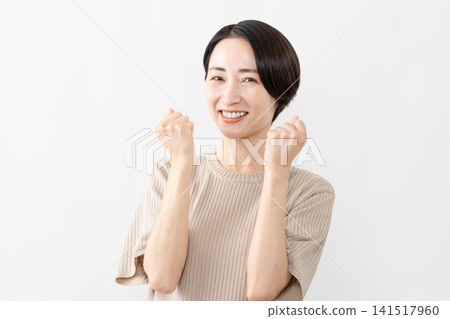 A woman in a short-sleeved knit top - Lifestyle image A woman in a short-sleeved knit top - Lifestyle image 141517960